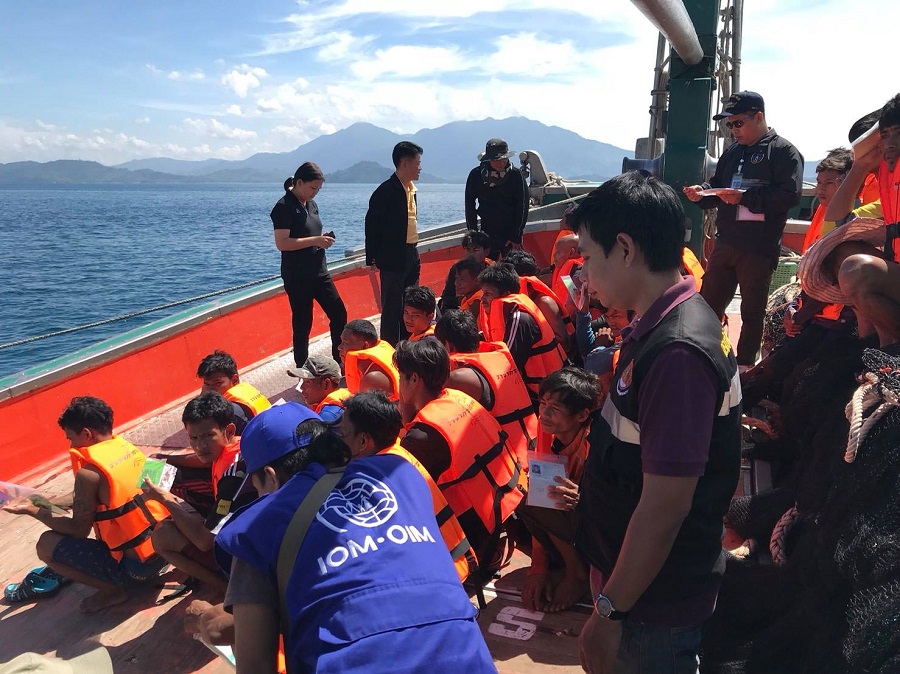 Reference image: Personnel from the International Organization for Migration with migrant workers on board of a Thai ship. Photo by IOM, Facebook.