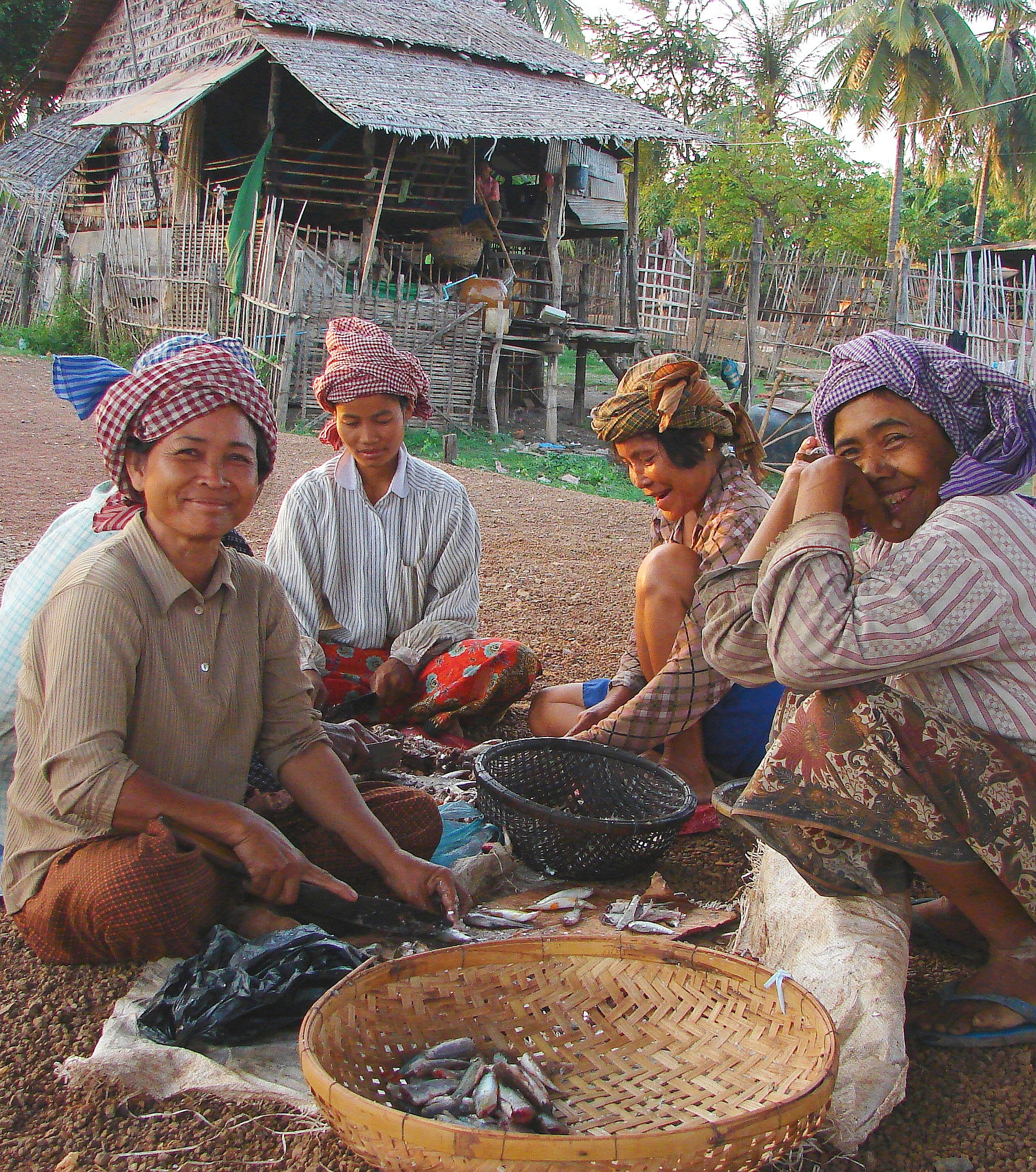 Women processing fish in Cambodia. Photo by Adelia Ribier, Flickr.