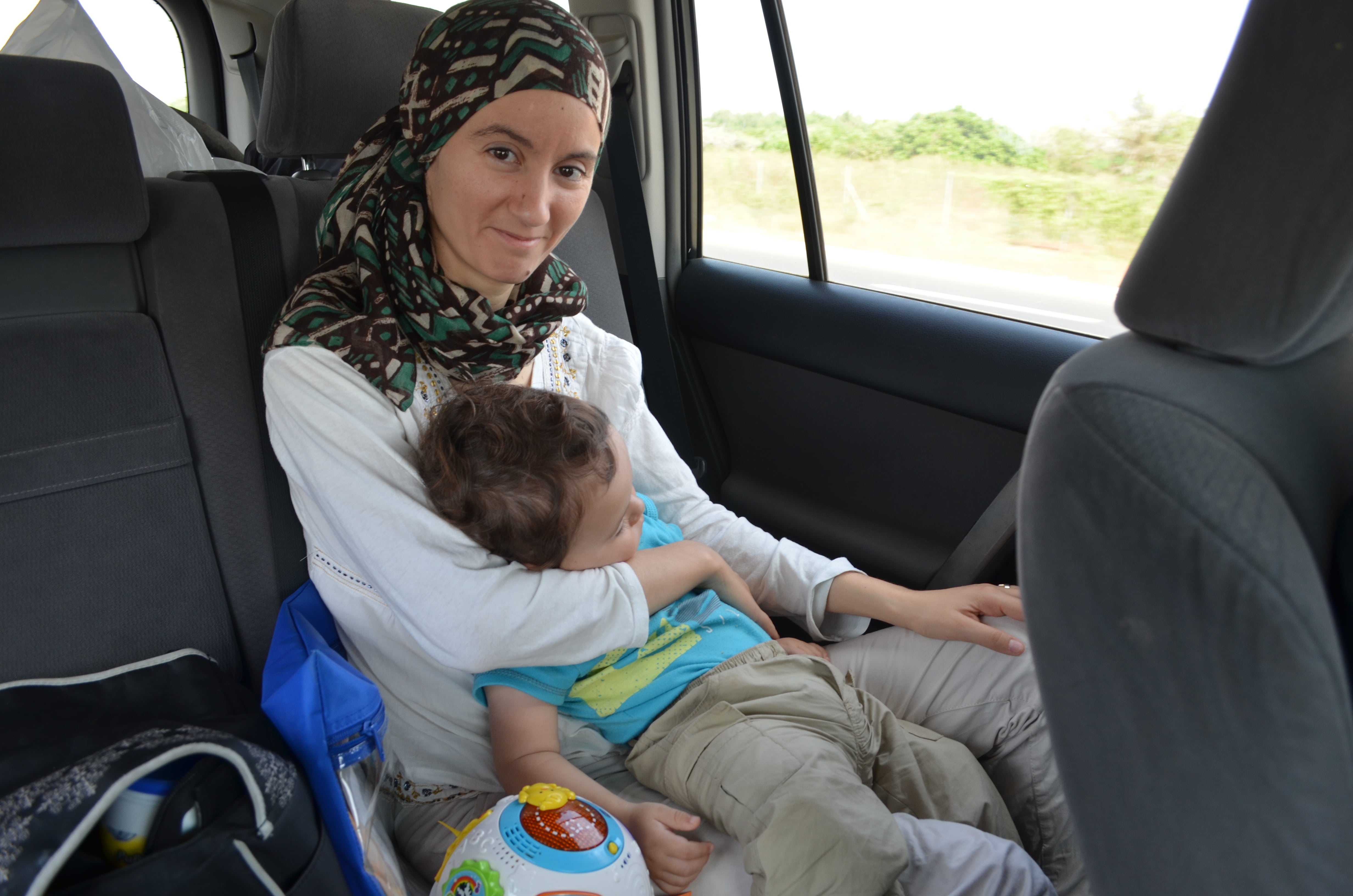 Dyhia and baby, Ilyas, looking content on the first hour (out of 12 hours) on our drive from Dakar to Banjul.